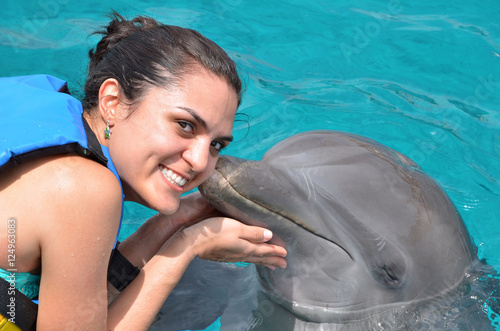 dolphin kiss young woman