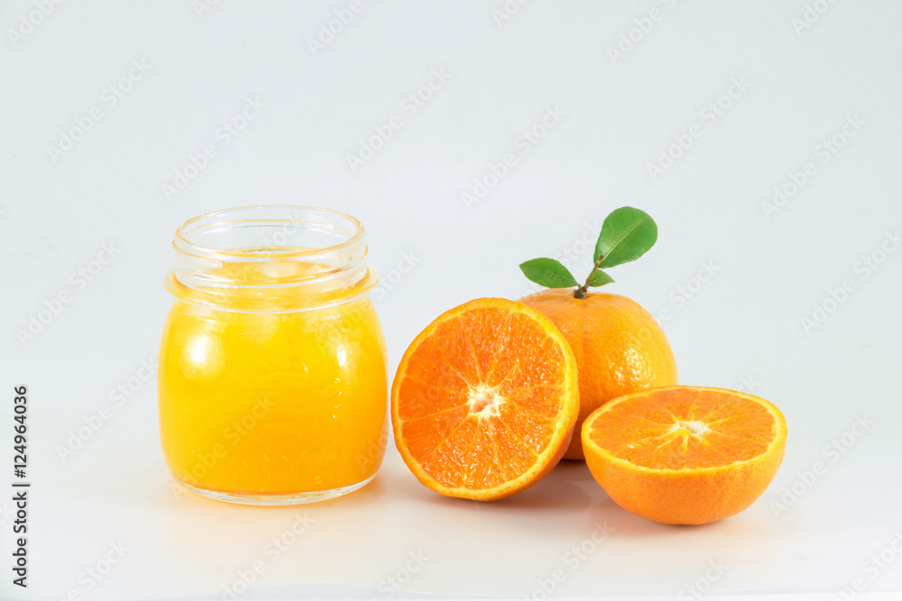 Orange juice and slices of orange isolated on white Orange juice and slices of orange isolated on white