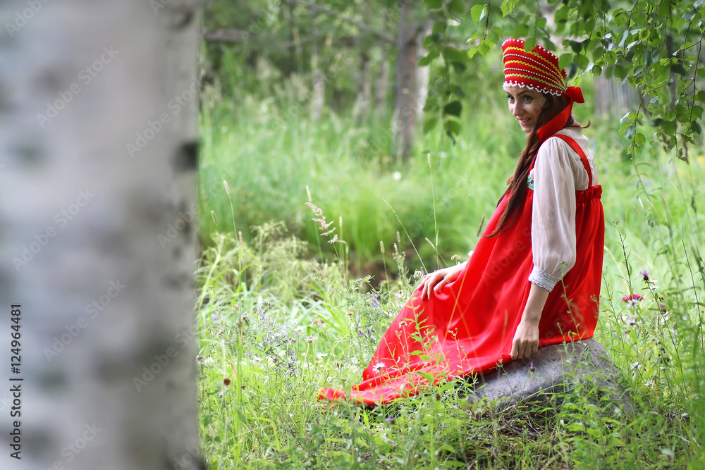Slav in traditional dress is sitting in nature Slav in traditional dress is sitting in nature