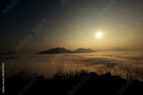The sea of fog with forests as foreground. The sea of mist with forests as foreground. This place is in the Poo tork LOI, Thailand. photo