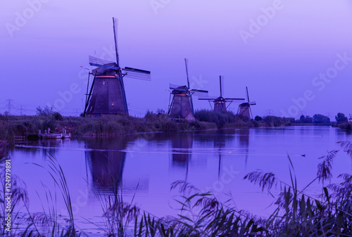 Colorful autumn scene in the famous Kinderdijk canals with windm photo