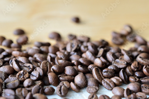 Fototapeta Naklejka Na Ścianę i Meble -  Roasted coffee beans on a wooden background