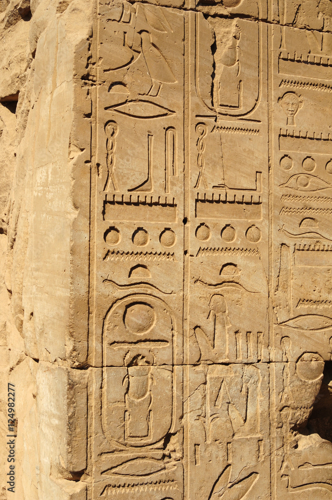 Ancient Egypt. The columns are decorated with carved hieroglyphs. Karnak Temple. Luxor. Thebes.