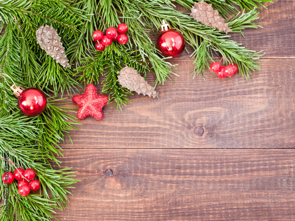 Christmas fir tree with decoration on wooden background Christmas fir tree with decoration on wooden background