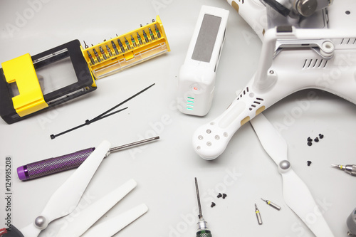 Repair maitenance drone, propellers, screws, screwdriver photo