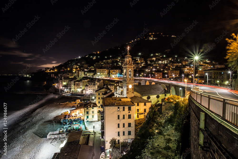 Night view / City at night, panoramic scene at Sori Liguria Italy / Dark night / night view with church on the beach in the dark night