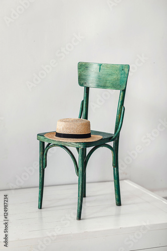 Summer panama straw hat on stool in stidio photo