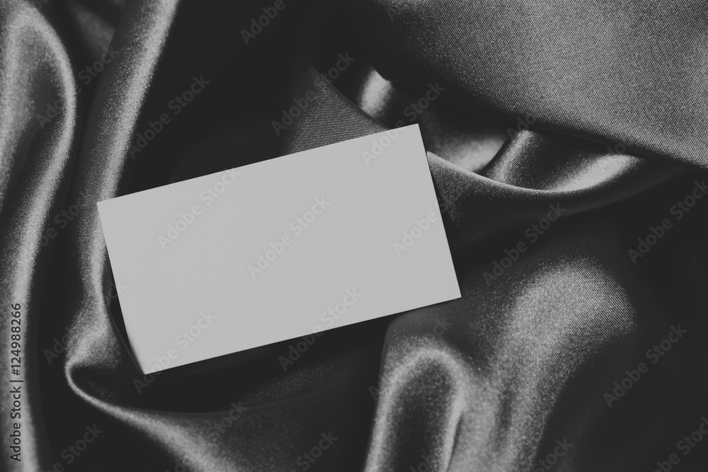card on monochrome fabric background card on monochrome fabric background