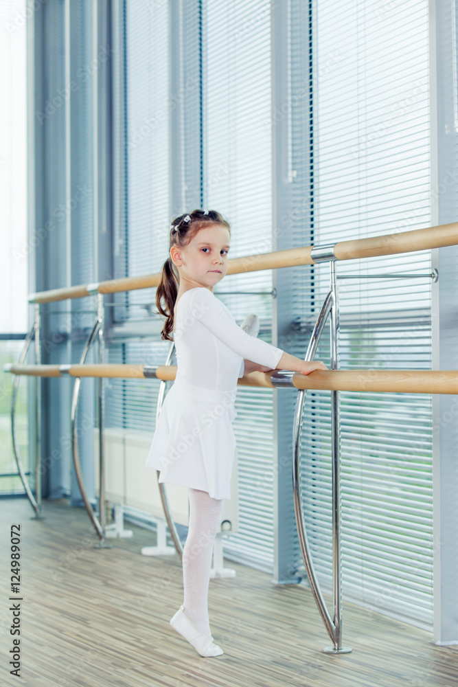 Little ballerina girl. Adorable child dancing classical ballet i Little ballerina girl. Adorable child dancing classical ballet i