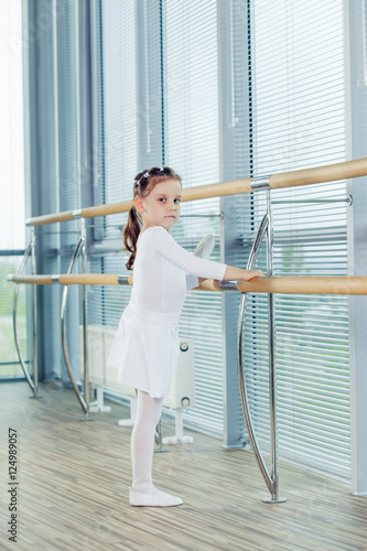 Little ballerina girl. Adorable child dancing classical ballet i