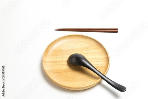 Wooden plate or tray with chopsticks and spoon isolated on white background