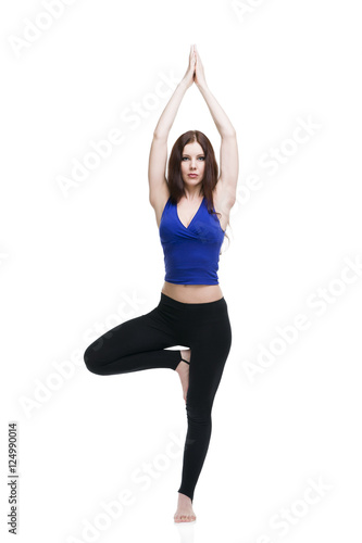 Young beautiful caucasian woman in yoga pose in studio isolated on white background