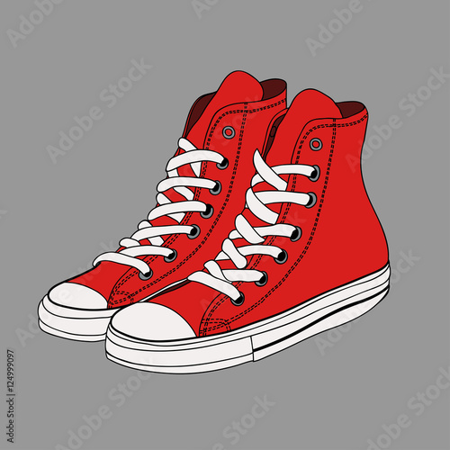 Pair of red gumshoes. Teenage school street wear.side view sneakers