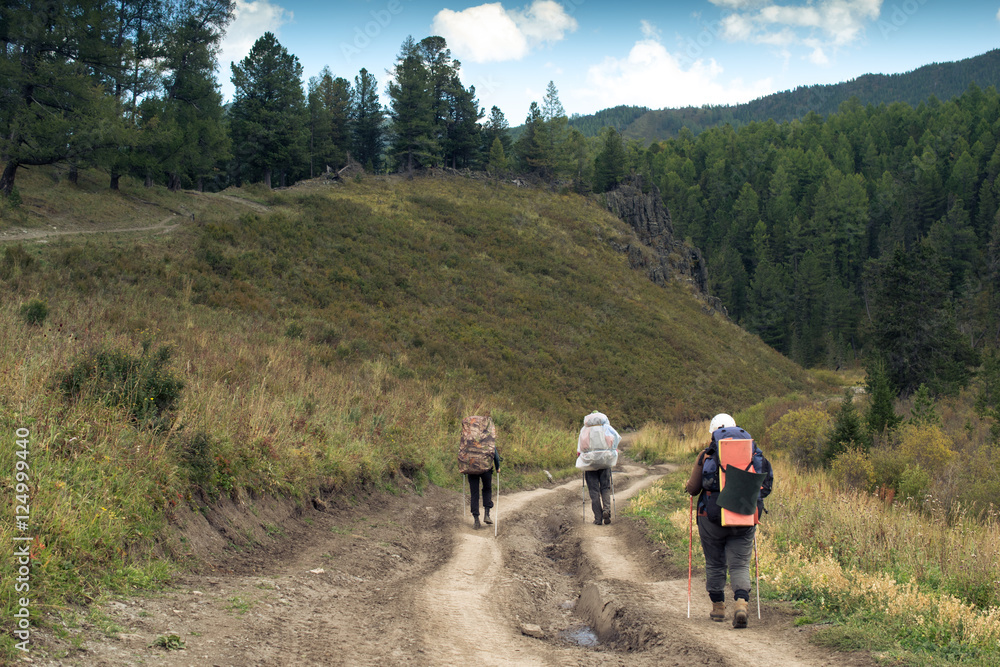 Tourists on the road in the Altai mountains, Russia