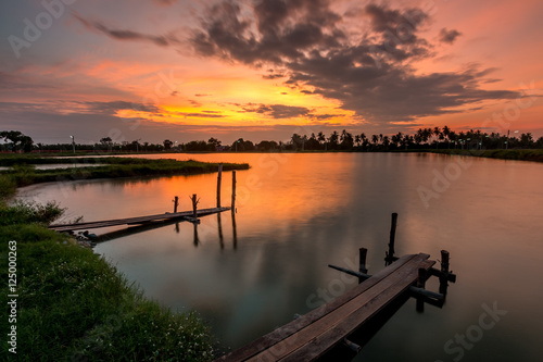 Sunset over the lake in the village.