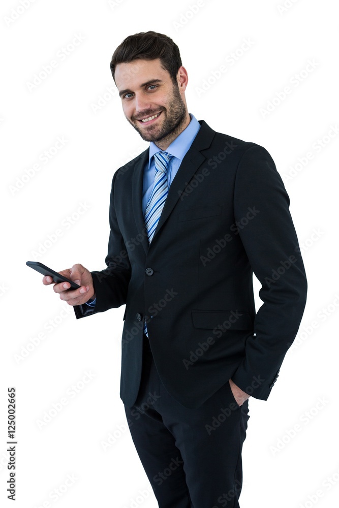 Portrait of businessman text messaging on mobile phone Portrait of businessman text messaging on mobile phone