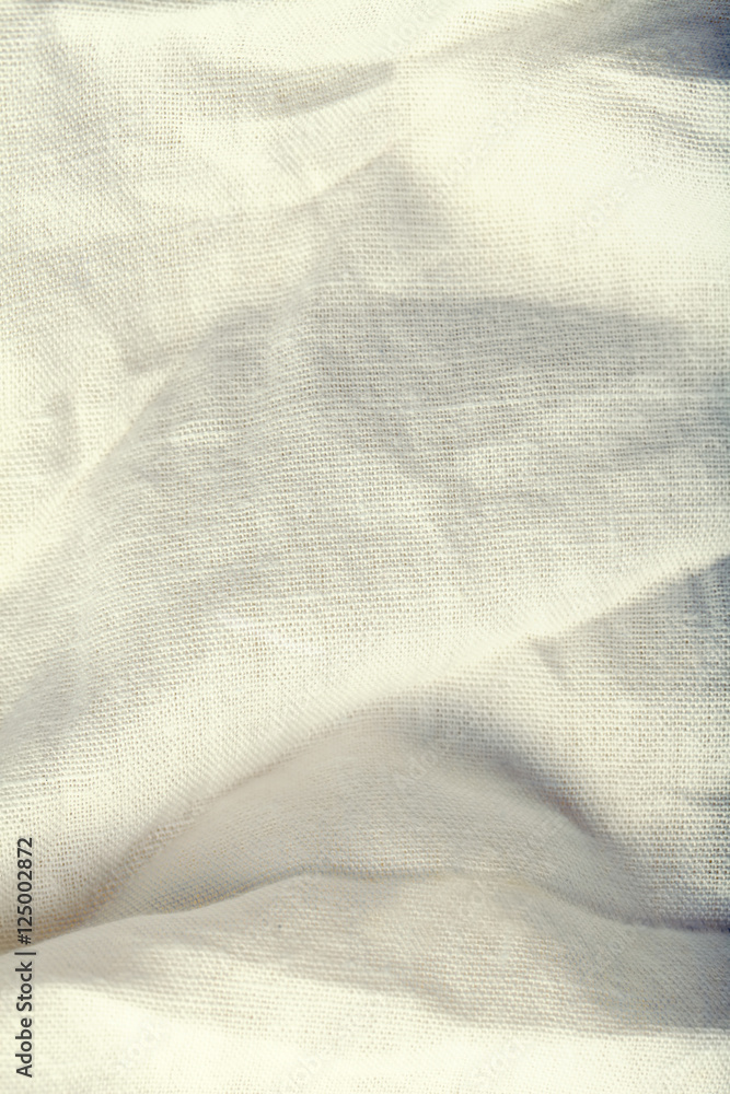 White wrinkled fabric, textured background White wrinkled fabric, textured background