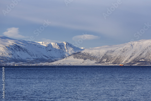 Ullsfjord with snow-covered mountains on Reinoya Island, Troms County, Norway