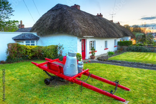 Village of traditional cottage houses in Adare, Ireland photo
