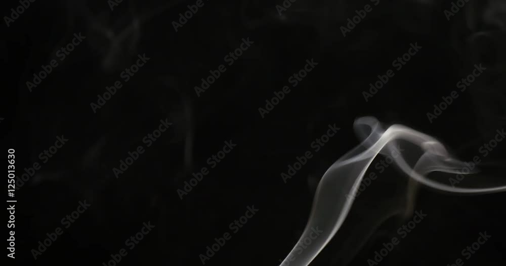 Smoke of cigarette rising on a black
Smoke of cigarette rising on a black