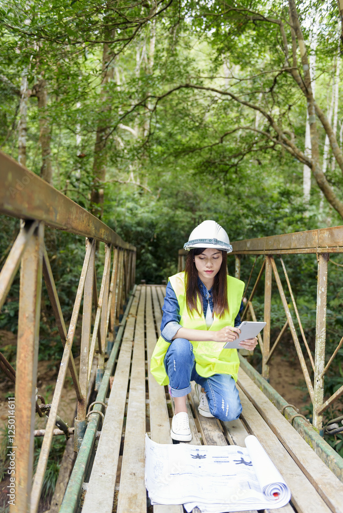 Portrait of happy smiling young engineer. Young female construct Portrait of happy smiling young engineer. Young female construct