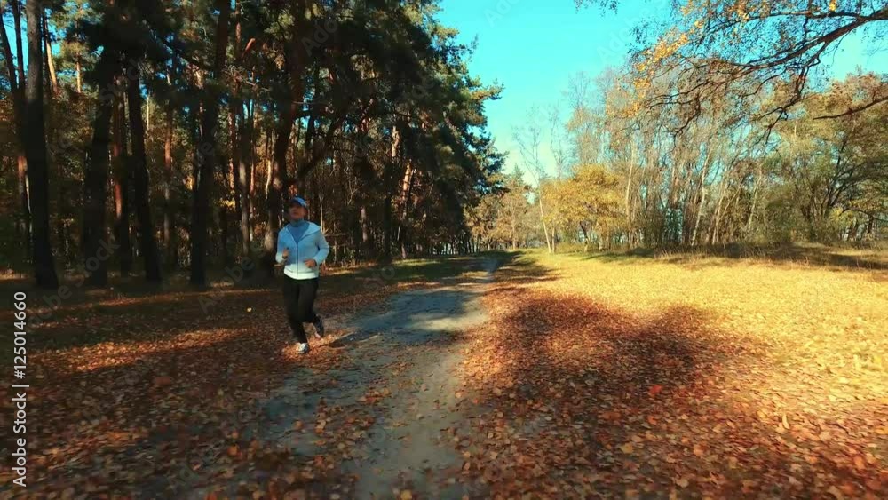 Girl running in the morning forest. Sport Girl running in the morning forest. Sport