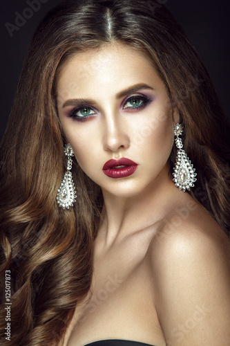 Wallpaper Mural Beautiful woman portrait on black background. Glamour make up and shiny earrings. Torontodigital.ca