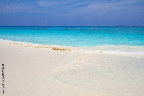 Wave of the sea on the sand beach