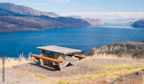 Picnic table over fantastic view at mountain lake.