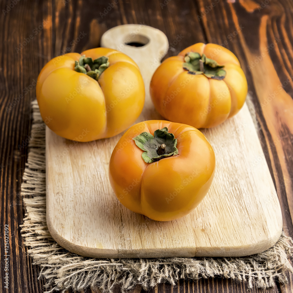 Three beautiful persimmons Three beautiful persimmons