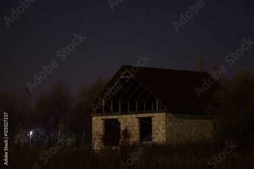 Abandoned house at night
