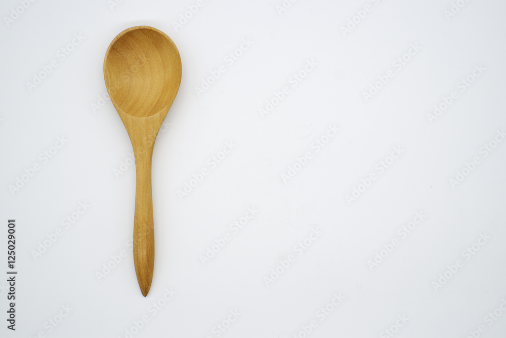 Close-up wooden spoon isolated on white background Close-up wooden spoon isolated on white background