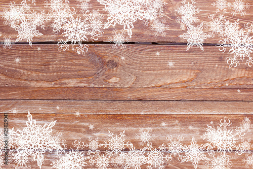 snowflakes on the wooden background