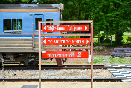 Signpost to south and north and to Su-ngai Kolok and Bangkok with Thai word on platform number two in Hua Hin Railway Station, Thailand