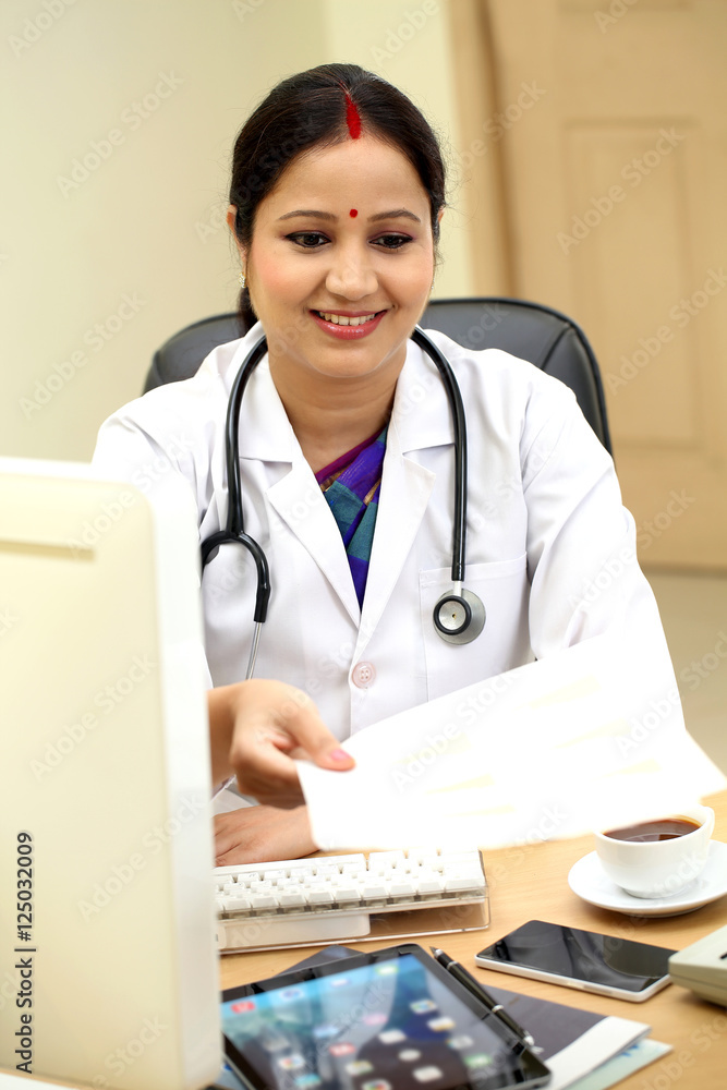 Young female doctor giving patient documents Young female doctor giving patient documents