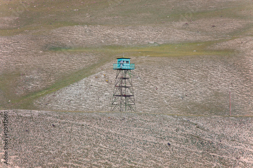 Guard tower with fake border guards in the Tien Shan photo