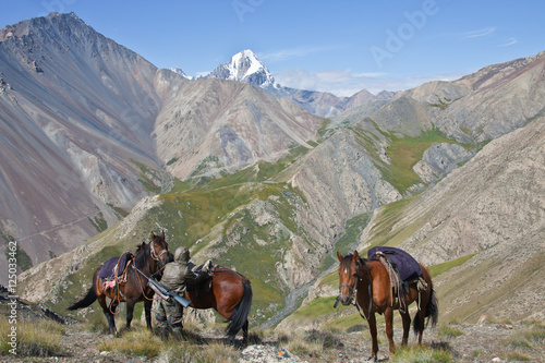 Hunter with rifle in the mountains of Tien Shan