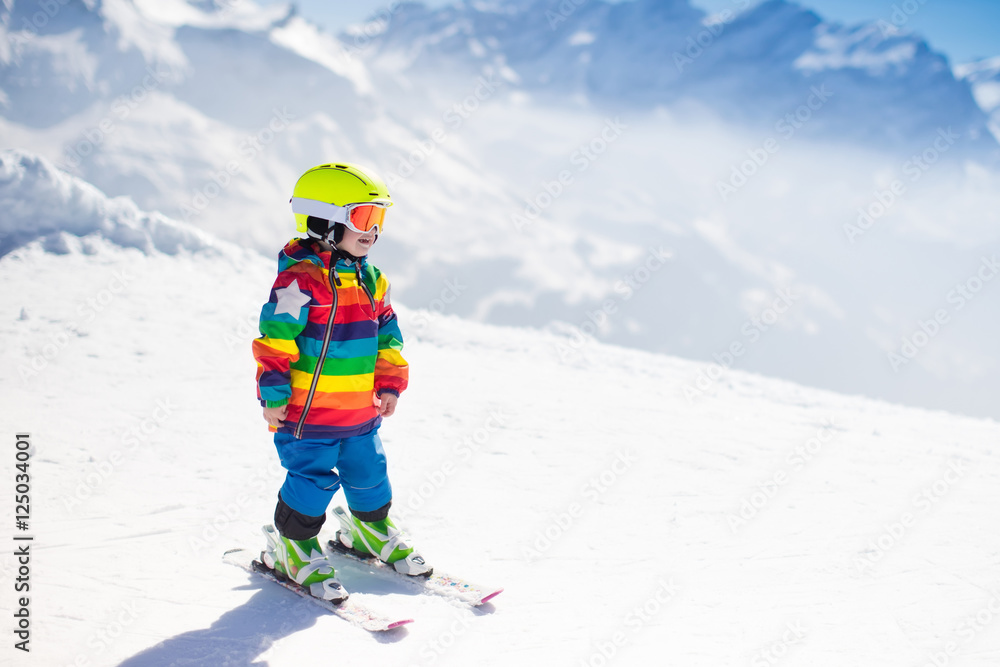 Little child skiing in the mountains