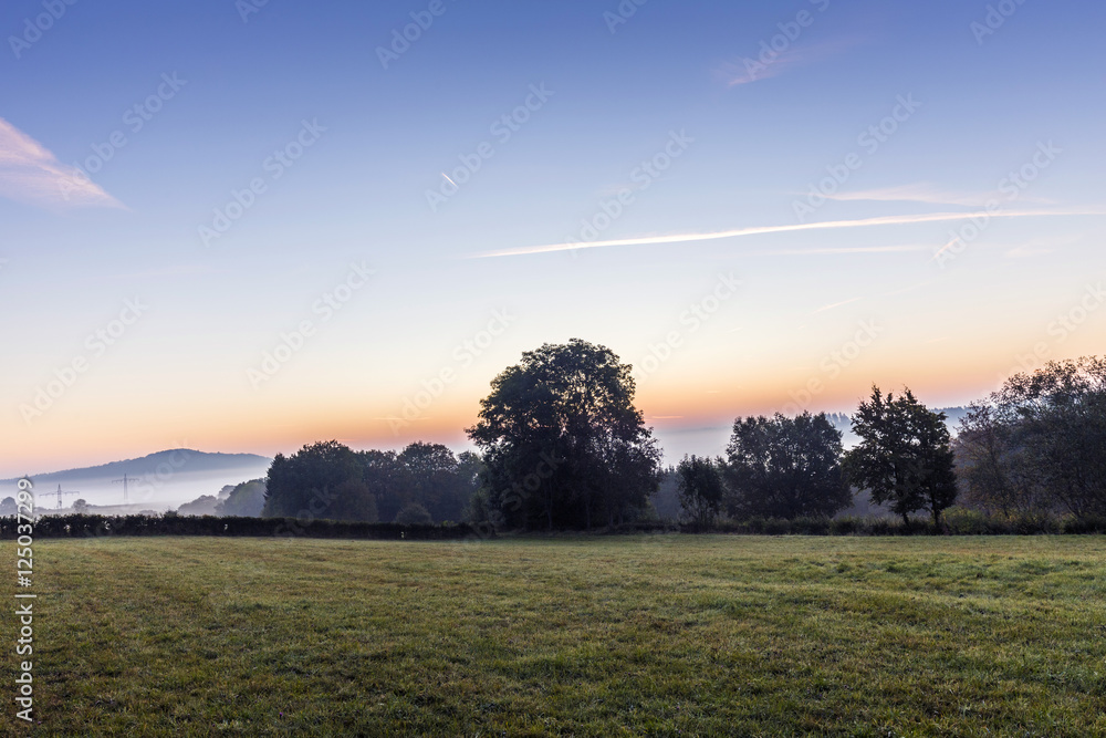 sunrise in german countryside with hills in the Eifel sunrise in german countryside with hills in the Eifel