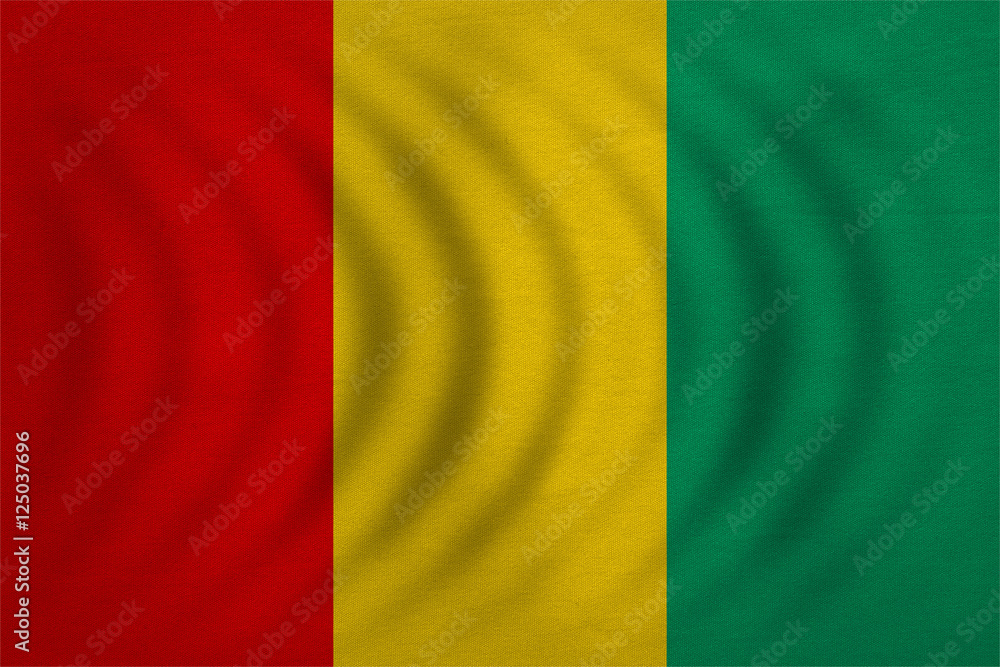 Flag of Guinea wavy, real detailed fabric texture