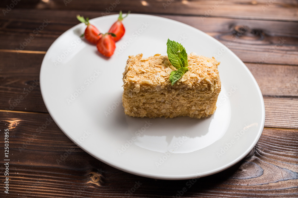 Napoleon cake on white plate Napoleon cake on white plate