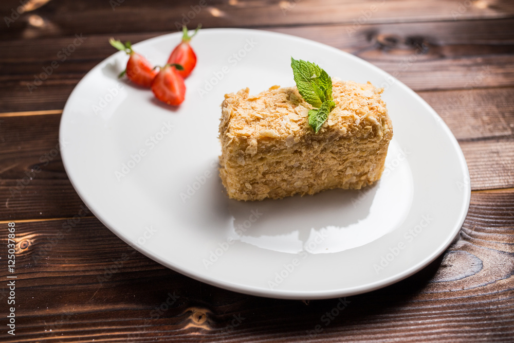 Napoleon cake on white plate Napoleon cake on white plate