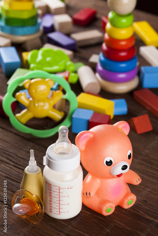 Pile of toys, collection on wooden background Pile of toys, collection on wooden background
