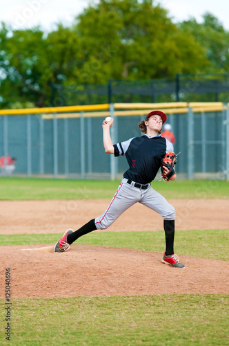 Youth baseball pitcher throwing