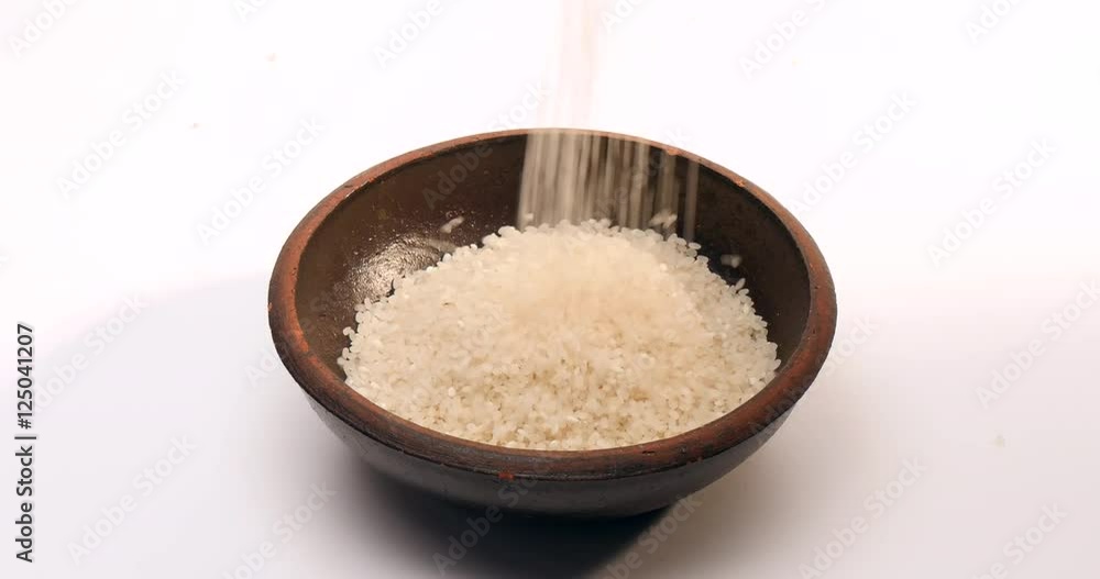 Pouring Rice fills a head of crock
Pouring Rice fills a head of crock