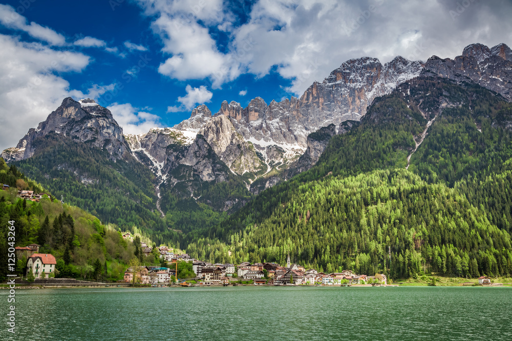 Breathtaking view of small town by the lake in Dolomites