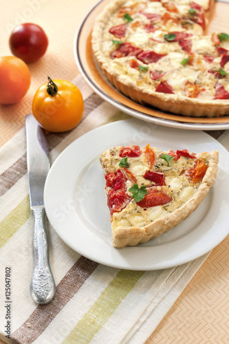 Tart with salted sheep cheese and tomatoes