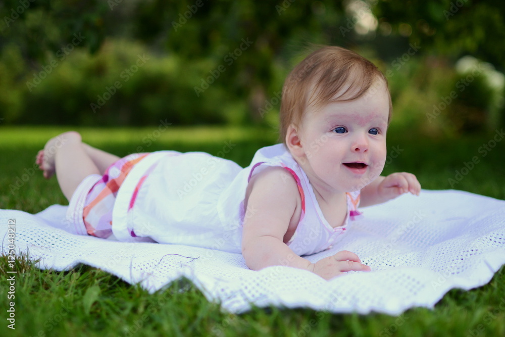 Little baby girl lying in the grass Little baby girl lying in the grass