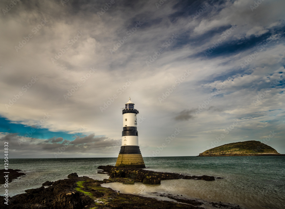 Penmon Lighthouse and Puffin Island, Anglesey, Wales.