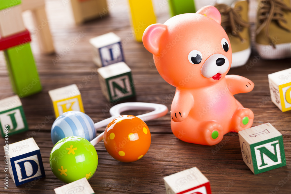 Obraz premium Set of children toys, Wooden background